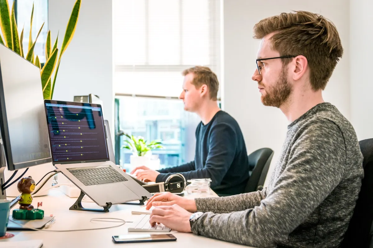 Professionals at modern office desks -ADHD workplace accommodations