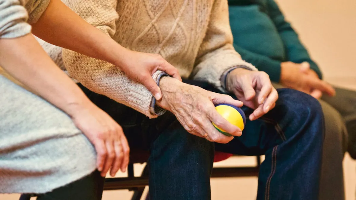 Person with arthritis using voice dictation on Mac
