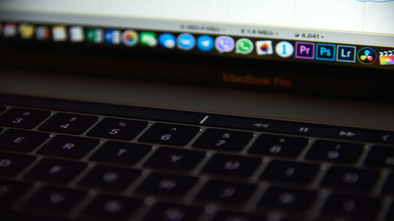 Close-up of a MacBook keyboard, representing the switch from typing to voice dictation on Mac