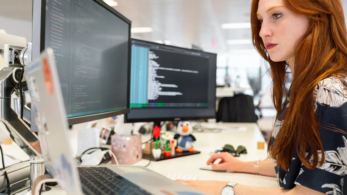 Person with headphones at Mac workstation transcribing audio from video